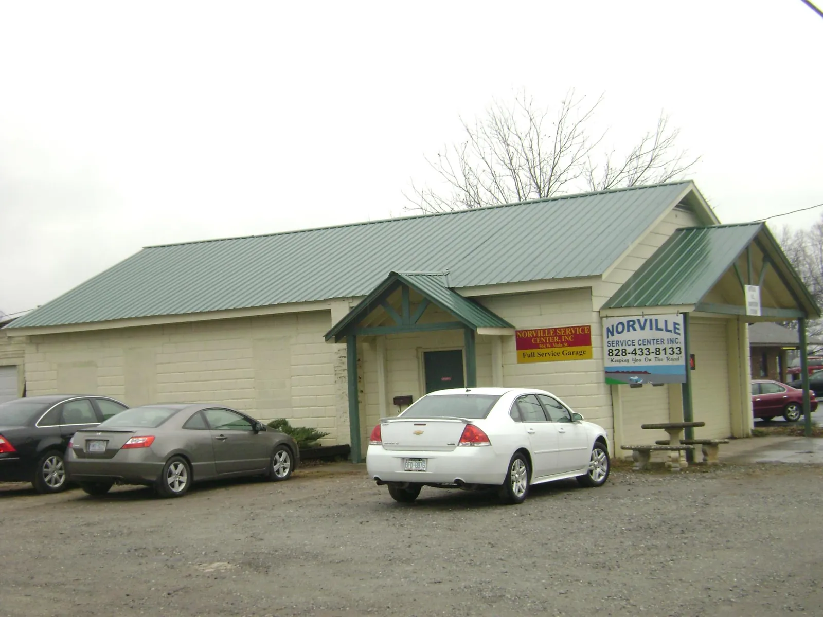 Green metal roof on a service garage with a covered entry in Montpelier